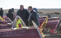 Церемония перезахоронения останков 115 жертв ВСУ в районе поселка Видное, Луганск, 11 ноября 2021 года